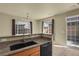 Kitchen features granite countertops and a view to outdoor space at 1356 Carlyle Park Cir, Highlands Ranch, CO 80129
