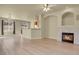 Bright and airy living space featuring a fireplace, light-colored flooring, and an open layout at 1356 Carlyle Park Cir, Highlands Ranch, CO 80129