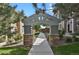Walkway features a pergola covered entrance to the property with stone columns at 1356 Carlyle Park Cir, Highlands Ranch, CO 80129