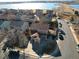 Aerial view of a well-maintained home near a lake, showcasing its desirable location at 715 Mockingbird St, Brighton, CO 80601