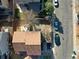 An aerial view showcasing the property's layout, backyard, and proximity to the street at 715 Mockingbird St, Brighton, CO 80601