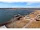 Beautiful lake with a walking path, pier, gazebo, and stunning mountain views at 715 Mockingbird St, Brighton, CO 80601