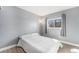 Cozy bedroom with a window letting in natural light, creating a peaceful retreat at 715 Mockingbird St, Brighton, CO 80601