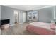 Spacious bedroom with attached bathroom and abundant natural light from windows at 715 Mockingbird St, Brighton, CO 80601
