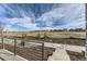 View of the backyard and neighborhood with an attractive fence and open space at 1288 S Algonquian St, Aurora, CO 80018