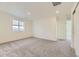 Large, empty bedroom featuring carpet, recessed lights and a large window at 1288 S Algonquian St, Aurora, CO 80018