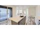 Open kitchen design with center island, stainless steel appliances, and access to outdoor patio at 1288 S Algonquian St, Aurora, CO 80018
