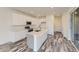 Contemporary kitchen with white cabinets, stainless steel appliances, and a center island at 1288 S Algonquian St, Aurora, CO 80018