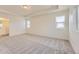 Spacious main bedroom features tray ceiling, plush carpeting and ample natural light at 1288 S Algonquian St, Aurora, CO 80018