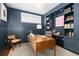 Modern home office with wood desk and built-in shelves at 2063 Cherry St, Denver, CO 80207