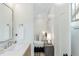 Bright bathroom featuring a single vanity next to the bedroom at 764 S Corona St, Denver, CO 80209
