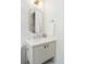 Elegant bathroom with a classic vanity, decorative mirror, and brushed nickel hardware at 764 S Corona St, Denver, CO 80209