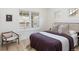 Bedroom with natural light, stylish chair, and a comfortable bed at 764 S Corona St, Denver, CO 80209