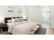 Bedroom featuring a comfortable bed, stylish rug, and natural light from the windows at 764 S Corona St, Denver, CO 80209