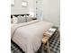 Bedroom featuring a comfortable bed, stylish rug, and natural light from the windows at 764 S Corona St, Denver, CO 80209