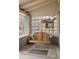 Inviting front porch featuring a wooden porch swing, beautiful brickwork, and neighborhood views at 764 S Corona St, Denver, CO 80209