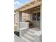 Inviting front porch with a charming wooden swing, perfect for relaxing outdoors at 764 S Corona St, Denver, CO 80209
