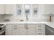Bright kitchen featuring quartz countertops, modern cabinetry, and stainless steel sink at 764 S Corona St, Denver, CO 80209