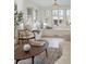 Bright sitting area with large windows, decorative pillows and a wooden coffee table at 764 S Corona St, Denver, CO 80209