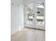 Bright white french doors lead to an outdoor patio with stylish modern furnishings at 764 S Corona St, Denver, CO 80209