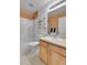 Bathroom featuring a shower and tub combo, and neutral sink vanity at 20948 E Hamilton Ave, Aurora, CO 80013