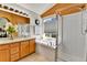 Bright bathroom with a large tub, glass enclosed shower, and honey colored vanity with sink at 20948 E Hamilton Ave, Aurora, CO 80013