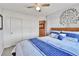 Bedroom featuring a large bed, neutral walls and carpet, and hall and closet access at 20948 E Hamilton Ave, Aurora, CO 80013