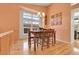 Elegant dining area featuring hardwood floors and a stylish chandelier at 20948 E Hamilton Ave, Aurora, CO 80013