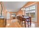 Open dining area featuring hardwood floors and modern chandelier at 20948 E Hamilton Ave, Aurora, CO 80013