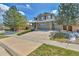 Beautiful two-story home boasts a spacious driveway and a three-car garage at 20948 E Hamilton Ave, Aurora, CO 80013