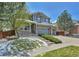Inviting two-story house with well-kept front yard and three car garage at 20948 E Hamilton Ave, Aurora, CO 80013