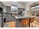 Modern kitchen featuring stainless steel appliances and granite countertops at 20948 E Hamilton Ave, Aurora, CO 80013