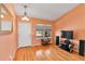 Cozy living room with hardwood floors, and two large front windows at 20948 E Hamilton Ave, Aurora, CO 80013