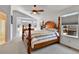 Bright main bedroom with a large bed, plenty of windows, and neutral decor creating a relaxing atmosphere at 20948 E Hamilton Ave, Aurora, CO 80013