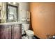 Half bath featuring granite counters, and decorative touches at 23774 E 36Th Pl, Aurora, CO 80019