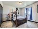 Cozy bedroom with carpet, natural light, and four-poster bed at 23774 E 36Th Pl, Aurora, CO 80019
