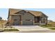 Charming single-Gathering home featuring a two-car garage, covered porch, and stone accents at 23774 E 36Th Pl, Aurora, CO 80019