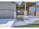 Inviting covered porch with stone pillars, metal railings, and comfortable seating at 23774 E 36Th Pl, Aurora, CO 80019