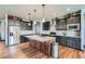 Well-lit kitchen with a center island, stainless steel appliances, and plenty of cabinet space at 23774 E 36Th Pl, Aurora, CO 80019