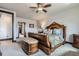 Comfortable bedroom featuring carpet, ceiling fan and walk-in closet at 23774 E 36Th Pl, Aurora, CO 80019