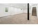 Finished basement with neutral carpet, white walls, and recessed lights, perfect for entertaining or relaxing at 3519 S Holly St, Denver, CO 80237