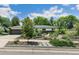 Well-maintained home with a driveway and a beautifully landscaped front yard at 3519 S Holly St, Denver, CO 80237