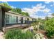 Charming home with a welcoming front porch and beautifully landscaped garden at 3519 S Holly St, Denver, CO 80237