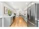 Modern kitchen with sleek countertops, stainless steel appliances, and hardwood floors at 3519 S Holly St, Denver, CO 80237