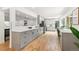 Large kitchen features stainless steel appliances, ample counter space, hardwood floors, and a modern design at 3519 S Holly St, Denver, CO 80237