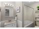 Cozy bathroom featuring a jacuzzi-style bathtub, vanity, and framed mirror at 544 Vance St, Lakewood, CO 80226