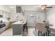 Bright kitchen with a breakfast bar, dining area and stainless steel appliances at 544 Vance St, Lakewood, CO 80226