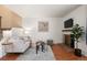 Cozy living room featuring a fireplace, hardwood floors and comfortable seating at 544 Vance St, Lakewood, CO 80226