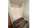 Clean bathroom with white tile bathtub and shower, complemented by wood-look vinyl flooring at 3415 S Ammons St # 24-2, Lakewood, CO 80227