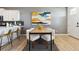 Bright dining area adjoining a modern kitchen, creating a seamless and inviting space for meals and gatherings at 673 N Tempe St, Aurora, CO 80018